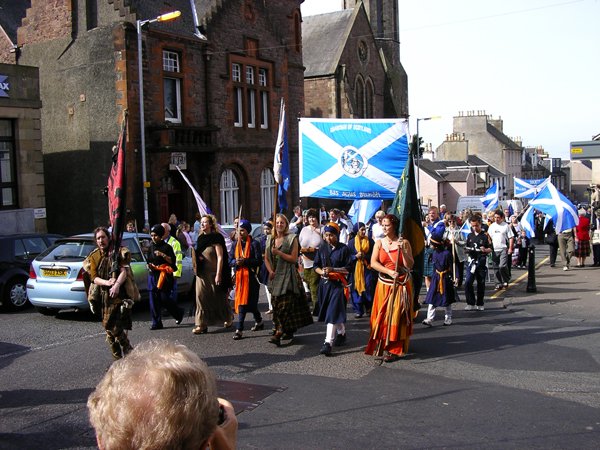 The front of the march arrives in Lanark