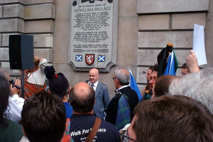 Scott Begbie speaks at the plaque, St Bartholomew's